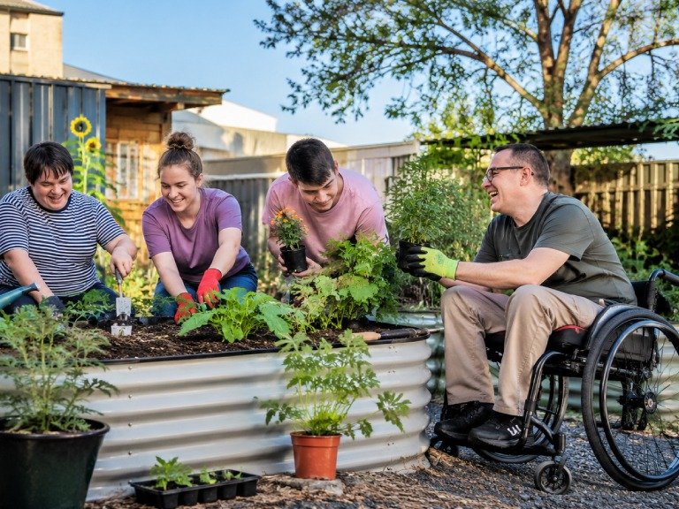 People taking part in an inclusive community gardening program